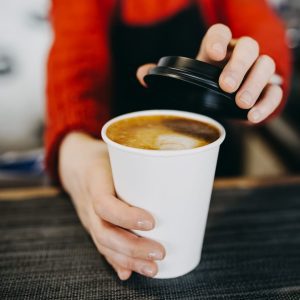 Barista serving coffee